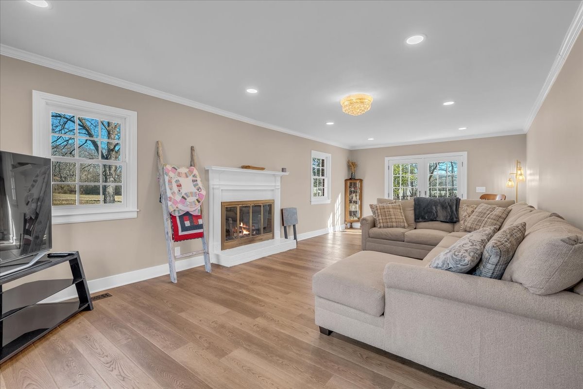 251 Miller Road Hillsboro, TN 37342 - Photo 12 of 80 a living room with furniture a flat screen tv and a fireplace