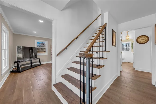 a kitchen with a table chairs sink and cabinets