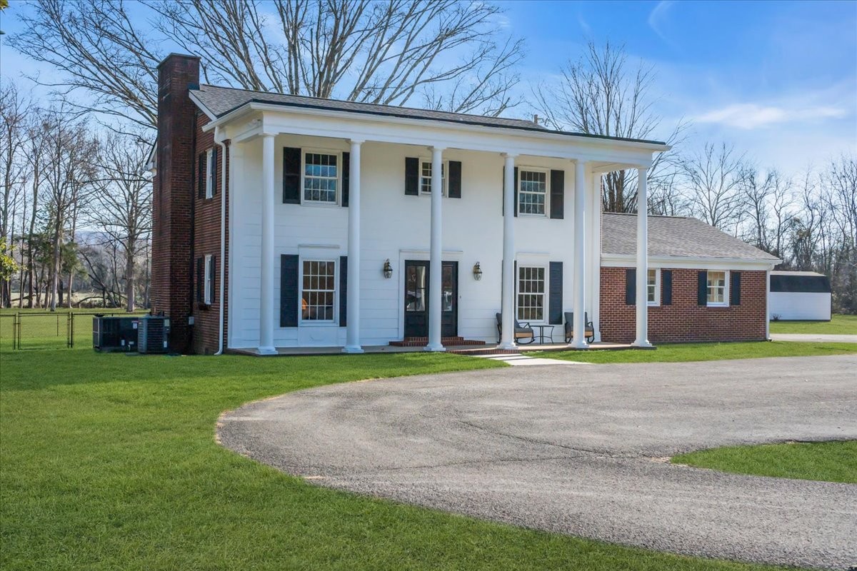 251 Miller Road Hillsboro, TN 37342 - Photo 3 of 80 a front view of a house with a yard