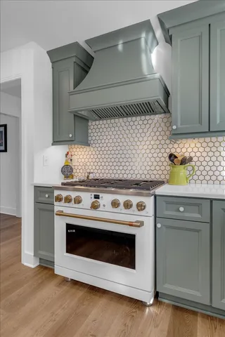 a spacious bedroom with a bed and a chandelier
