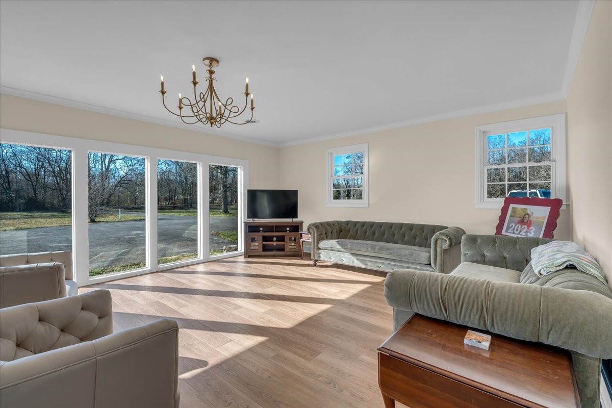 251 Miller Road Hillsboro, TN 37342 - Photo 4 of 80 a living room with furniture and a flat screen tv