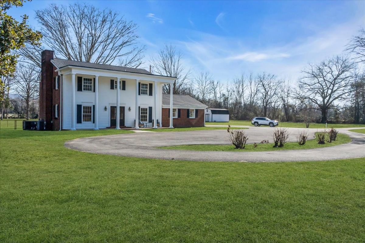 251 Miller Road Hillsboro, TN 37342 - Photo 6 of 80 a view of a house with a big yard and large trees