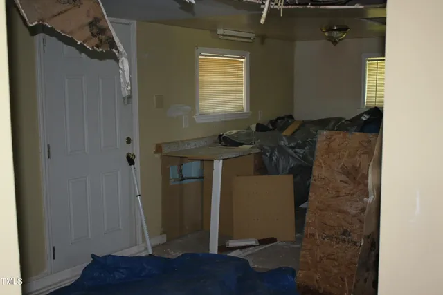 a utility room with closet dryer and washer