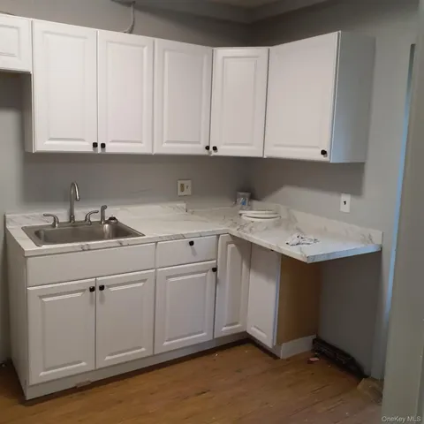 a kitchen with white cabinets