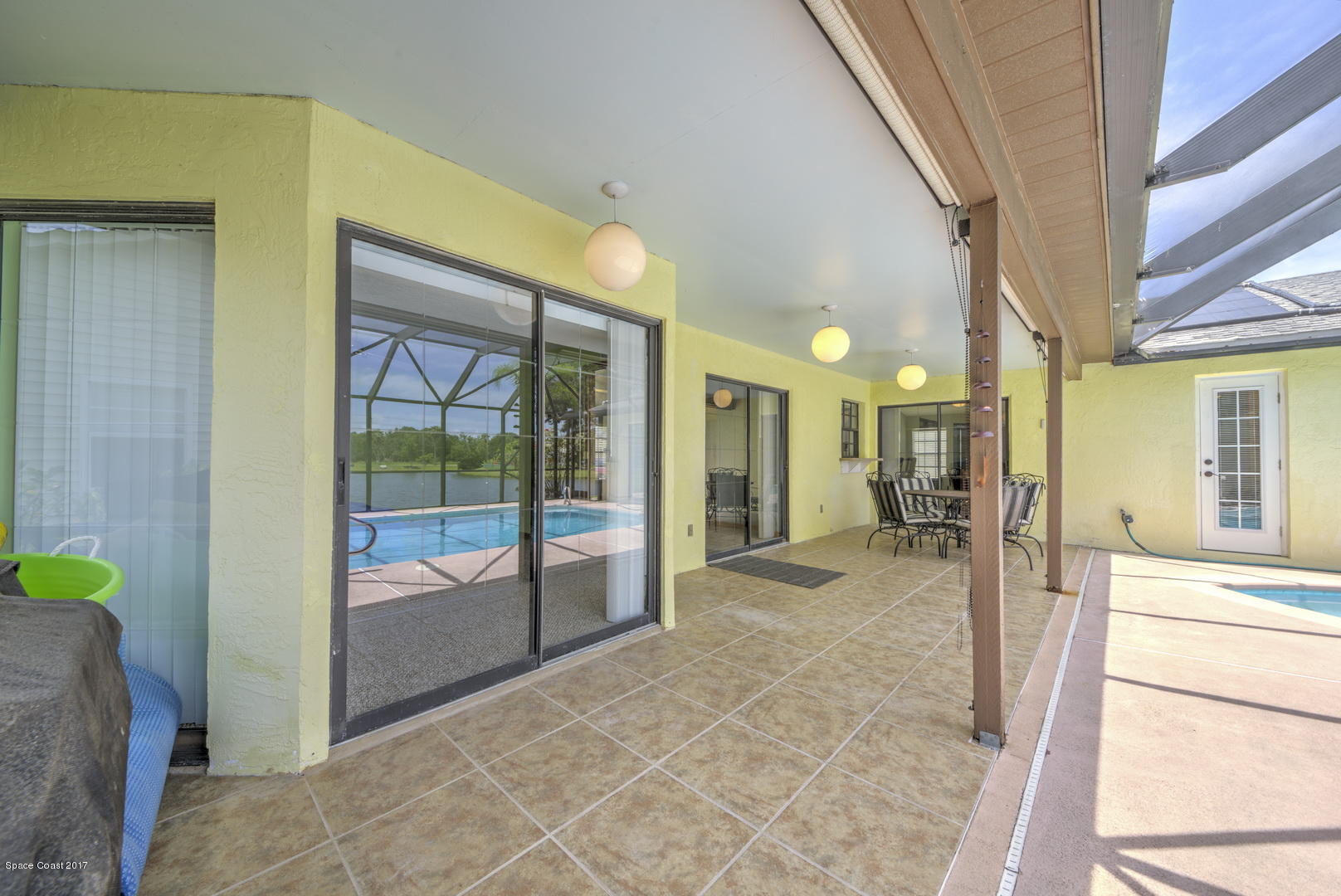 133 Oak Lake Road Melbourne, FL 32901 - Photo 35 of 45 Patio off Master Suite_Dining & Family R