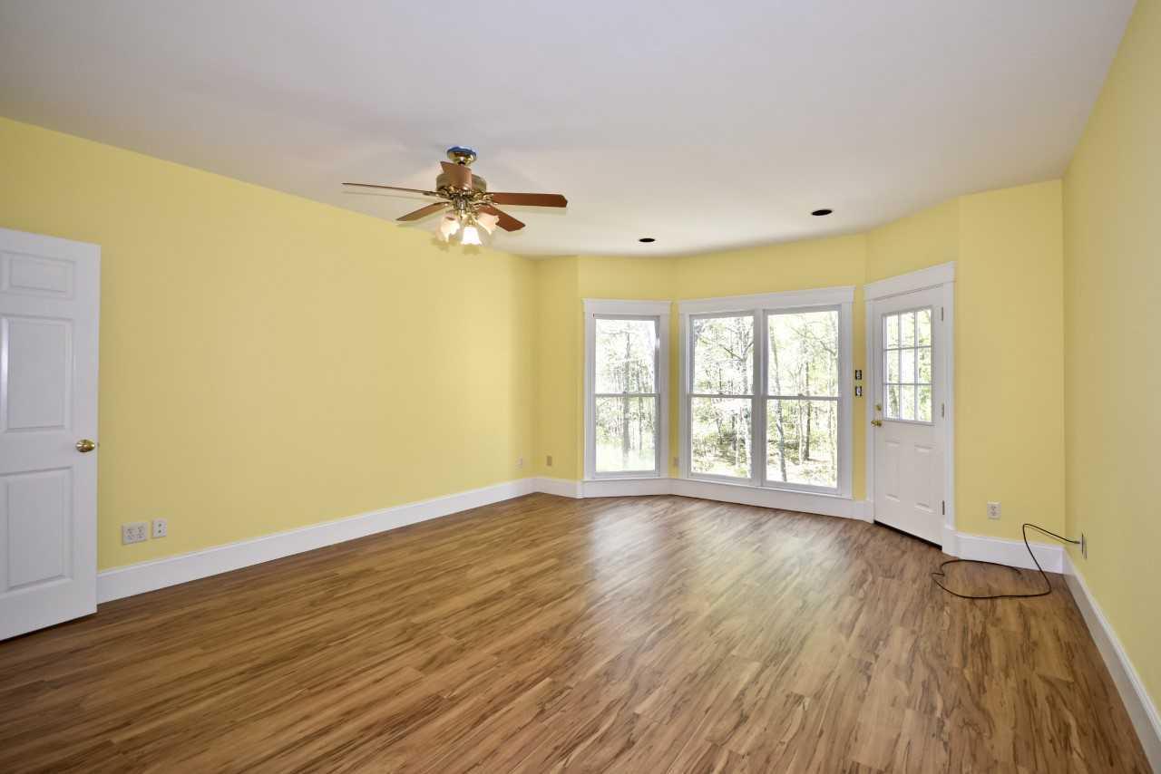 9 Hi River Road Marstons Mills, MA 02648 - Photo 20 of 34 a view of an empty room with a window and wooden floor