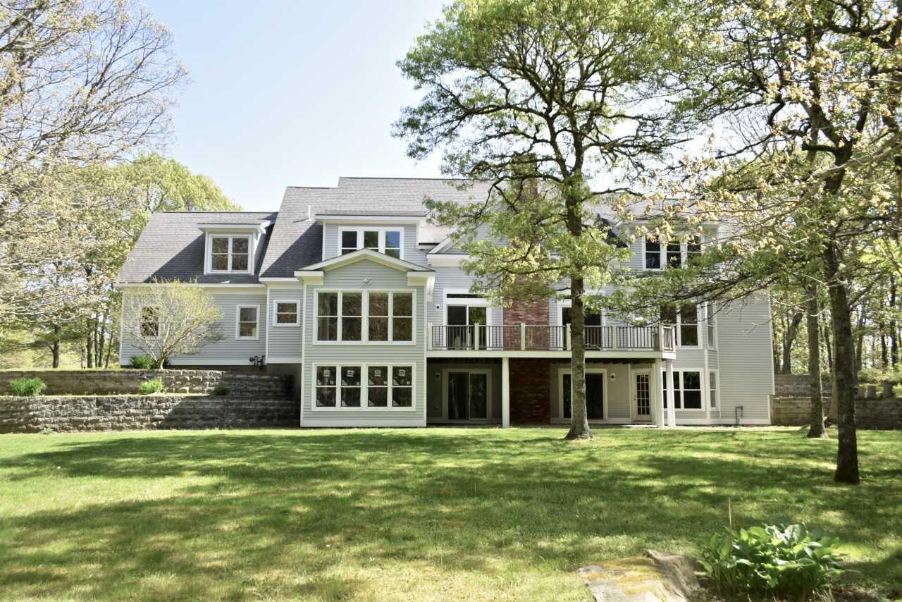 9 Hi River Road Marstons Mills, MA 02648 - Photo 5 of 34 a front view of a house with a garden