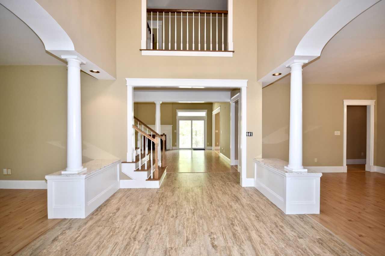 9 Hi River Road Marstons Mills, MA 02648 - Photo 6 of 34 a view of a hallway view with wooden floor and staircase