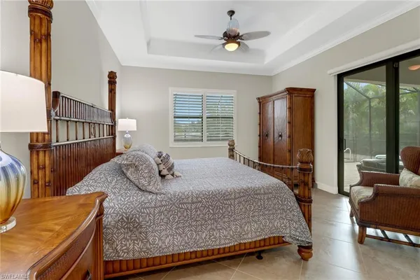 a bedroom with a bed a window and walk in closet