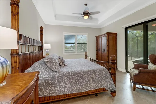 a bedroom with a bed a window and walk in closet