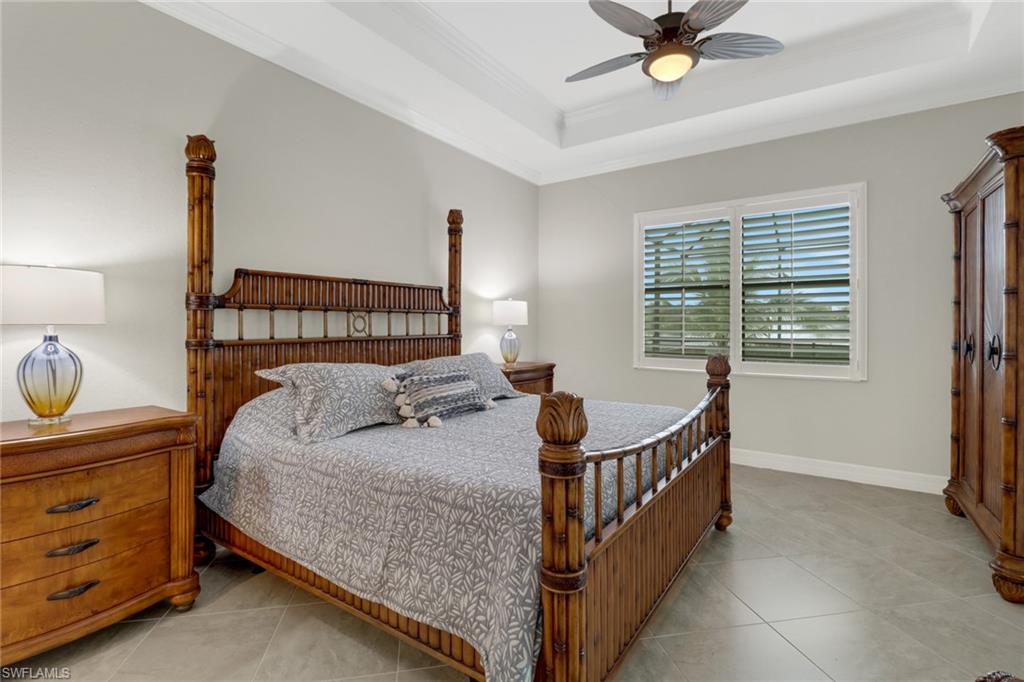1878 Mustique Street Naples, FL 34120 - Photo 24 of 50 a bed room with a bed and a window