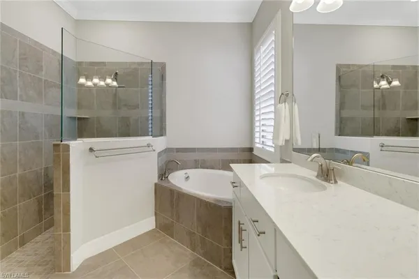 a bathroom with a bathtub and a sink