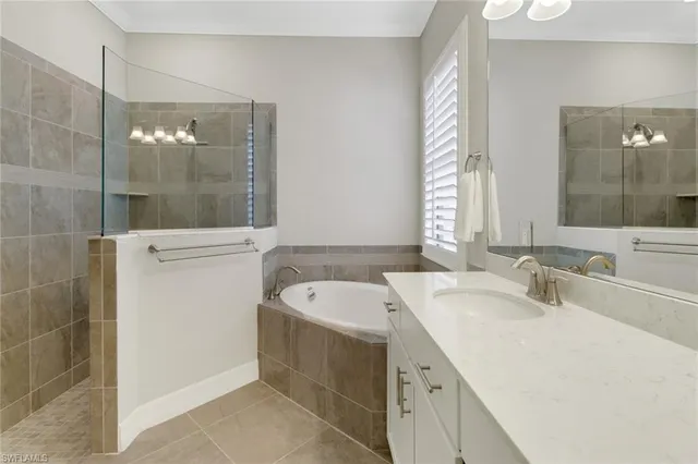 a bathroom with a bathtub and a sink