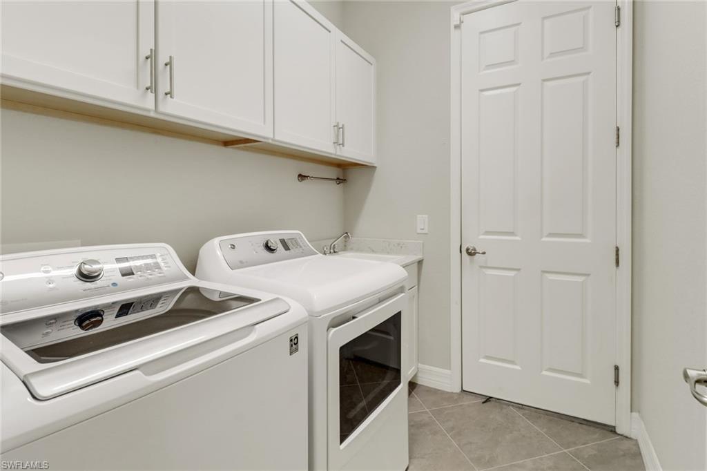 1878 Mustique Street Naples, FL 34120 - Photo 28 of 50 a utility room with dryer and washer