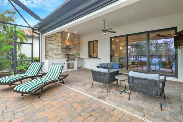 a balcony with furniture and a garden