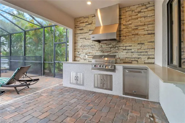 a kitchen with a stove a sink and a table