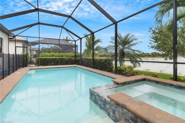 a view of a backyard with a swimming pool