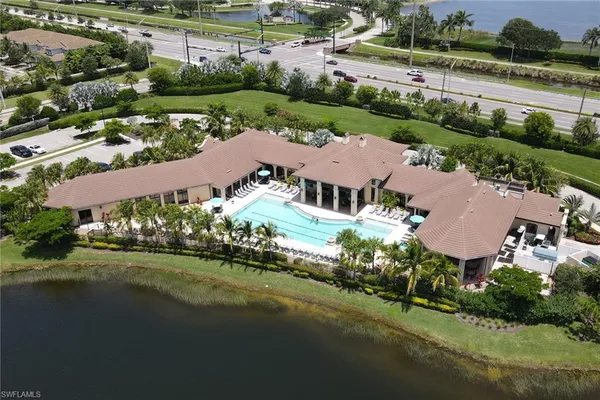 an aerial view of multiple houses with yard