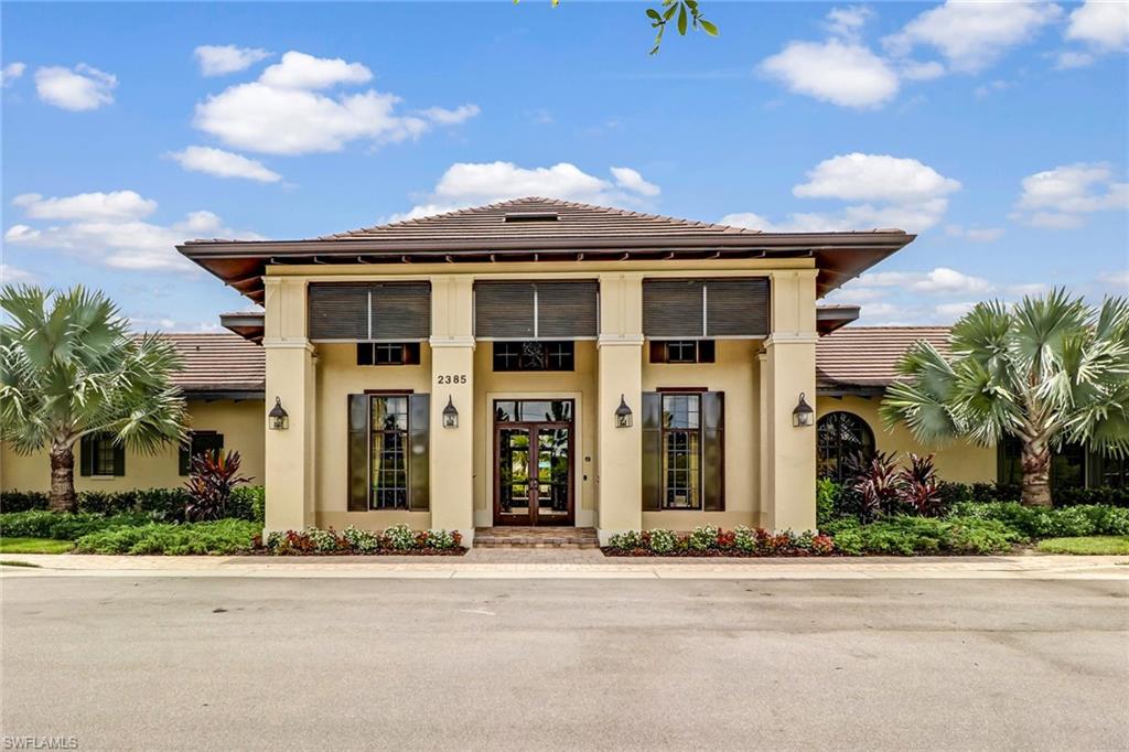 1878 Mustique Street Naples, FL 34120 - Photo 39 of 50 front view of a house with a yard