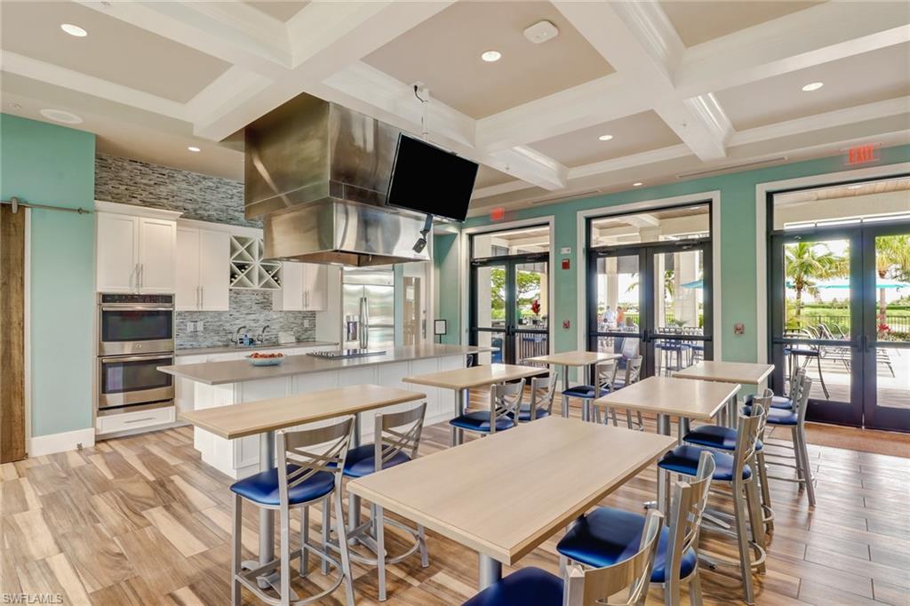 1878 Mustique Street Naples, FL 34120 - Photo 43 of 50 a view of a dining room with furniture window and wooden floor
