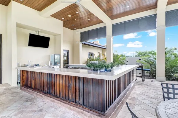 a view of a patio with a dining table and chairs