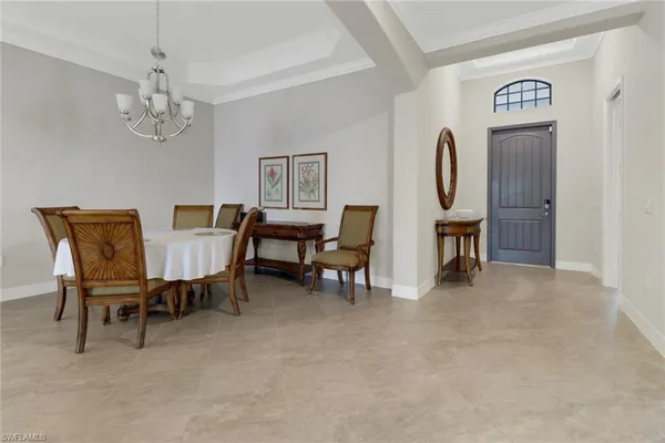 a view of a livingroom with furniture and chandelier