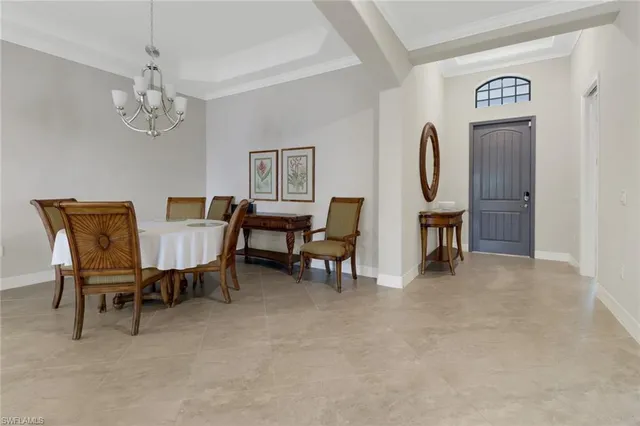 a view of a livingroom with furniture and chandelier