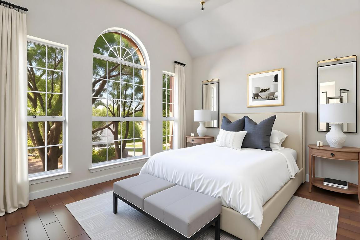 3913 Caney Creek Road Austin, TX 78732 - Photo 15 of 30 a bedroom with a bed and a large window