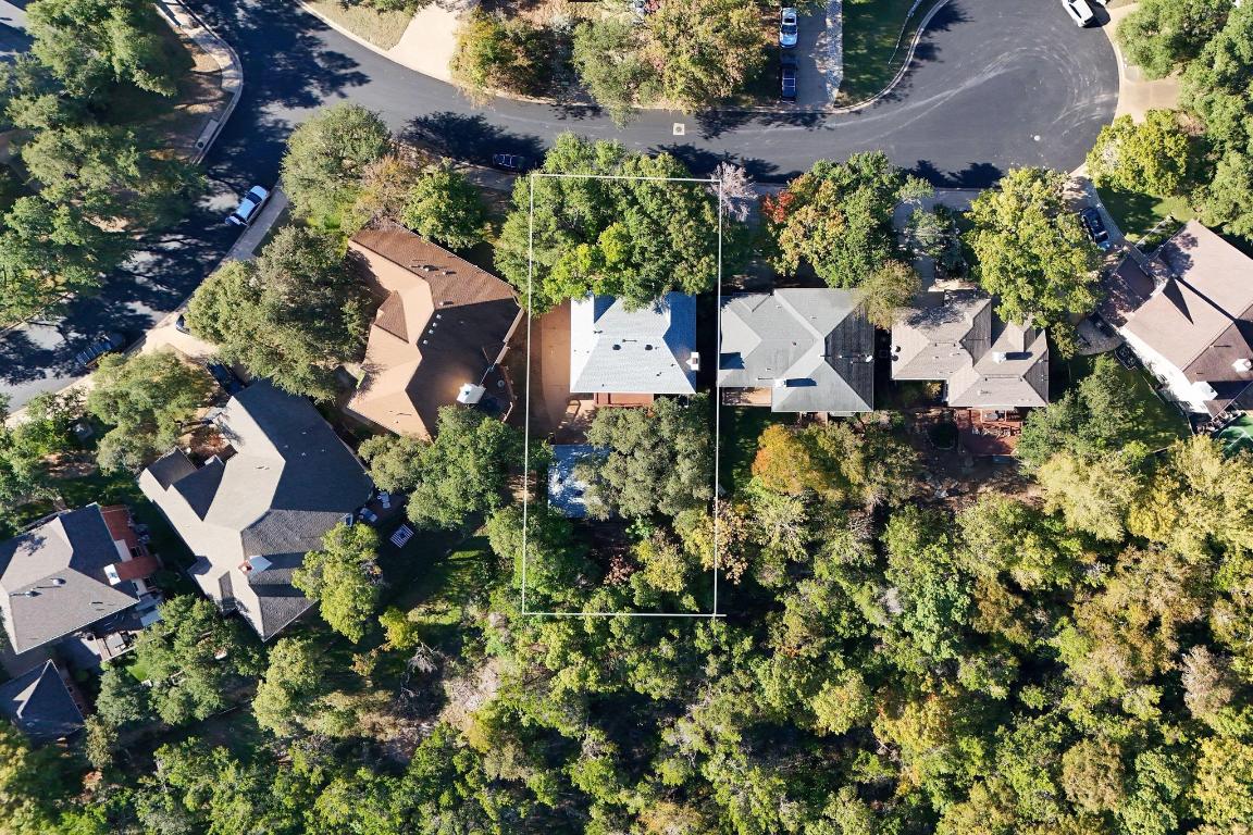 3913 Caney Creek Road Austin, TX 78732 - Photo 28 of 30 an aerial view of a house with a yard and garden