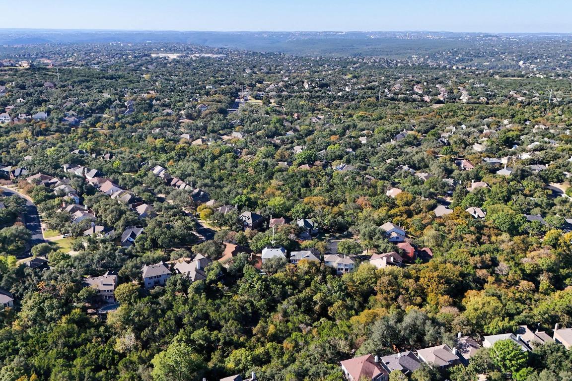 3913 Caney Creek Road Austin, TX 78732 - Photo 30 of 30 an aerial view of a houses with a lush green hillside
