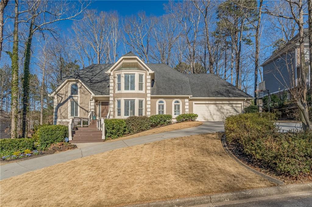474 Hillcroft Road Lawrenceville, GA 30044 - Photo 1 of 1 a front view of a house with garden