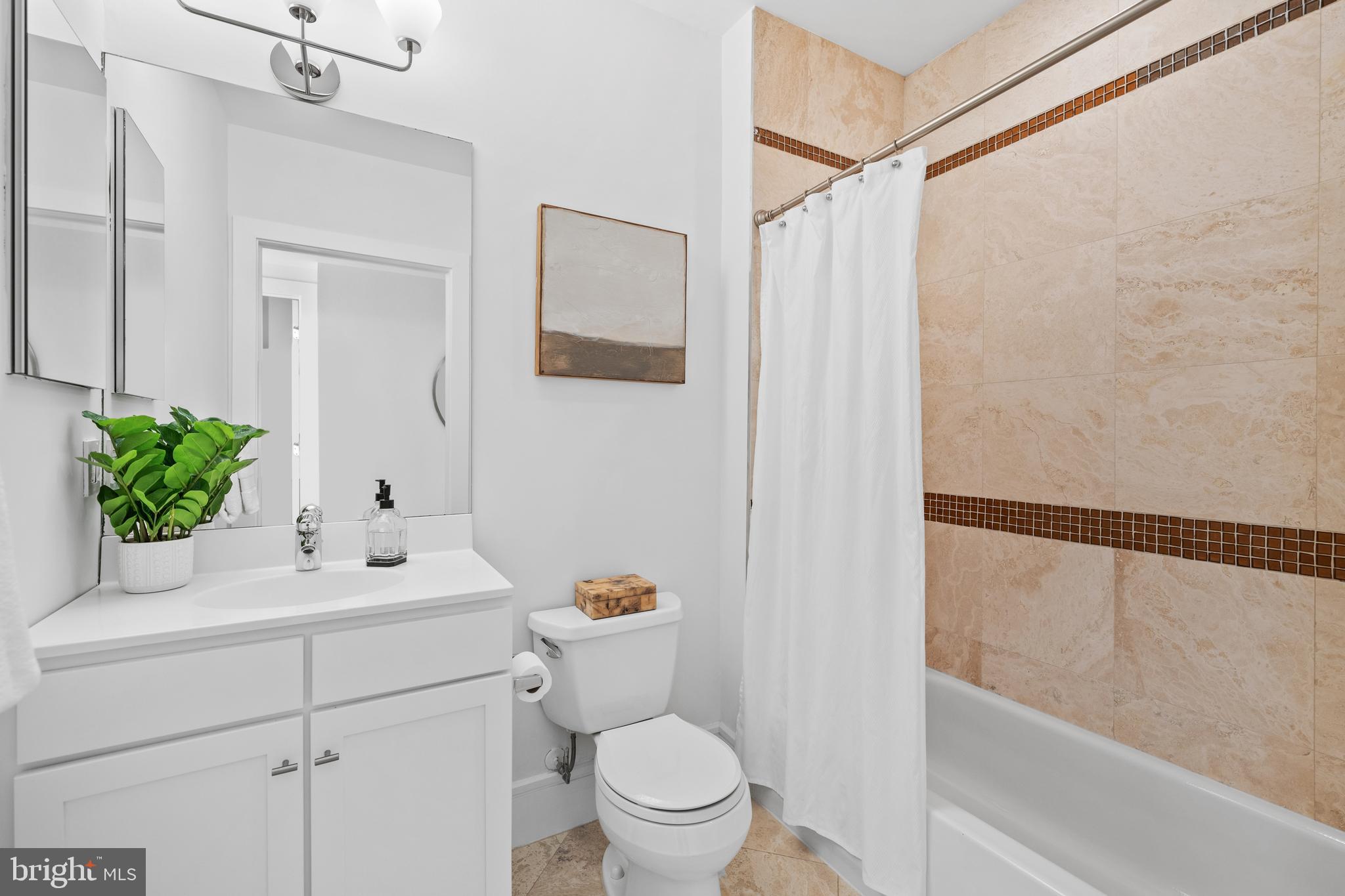 1654 Euclid Street Northwest, Unit 204 Washington, DC 20009 - Photo 19 of 20 a bathroom with a sink toilet and shower