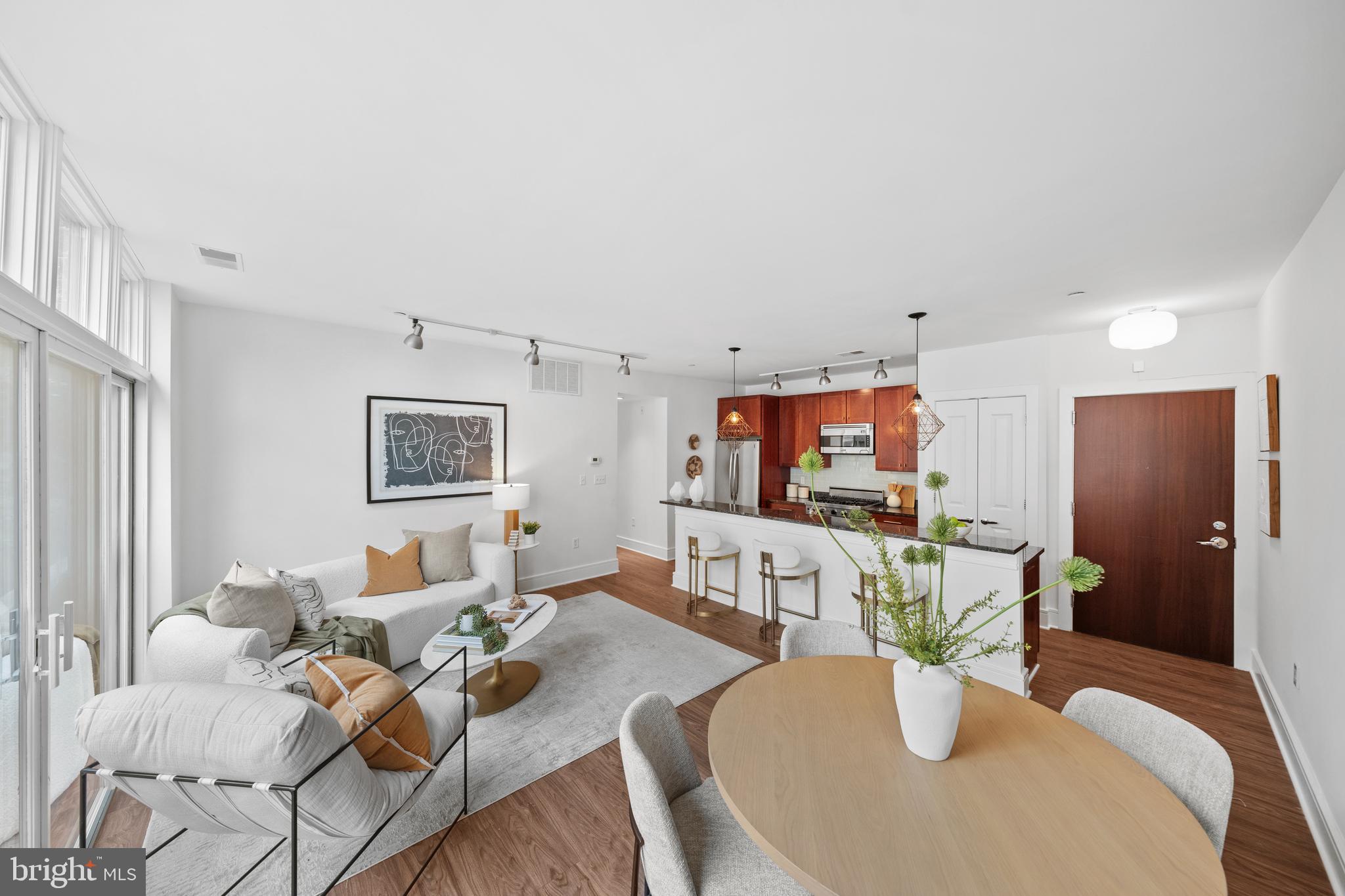 1654 Euclid Street Northwest, Unit 204 Washington, DC 20009 - Photo 7 of 20 a living room with furniture and a flat screen tv