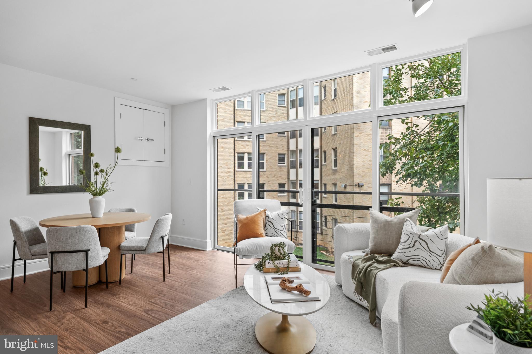 1654 Euclid Street Northwest, Unit 204 Washington, DC 20009 - Photo 10 of 20 a living room with furniture and a window