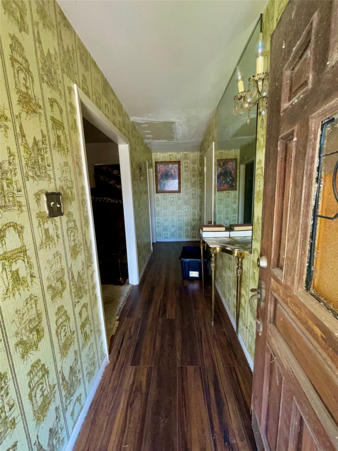4314 Reed Road Houston, TX 77051 - Photo 4 of 21 a view of a hallway with wooden floor and furniture