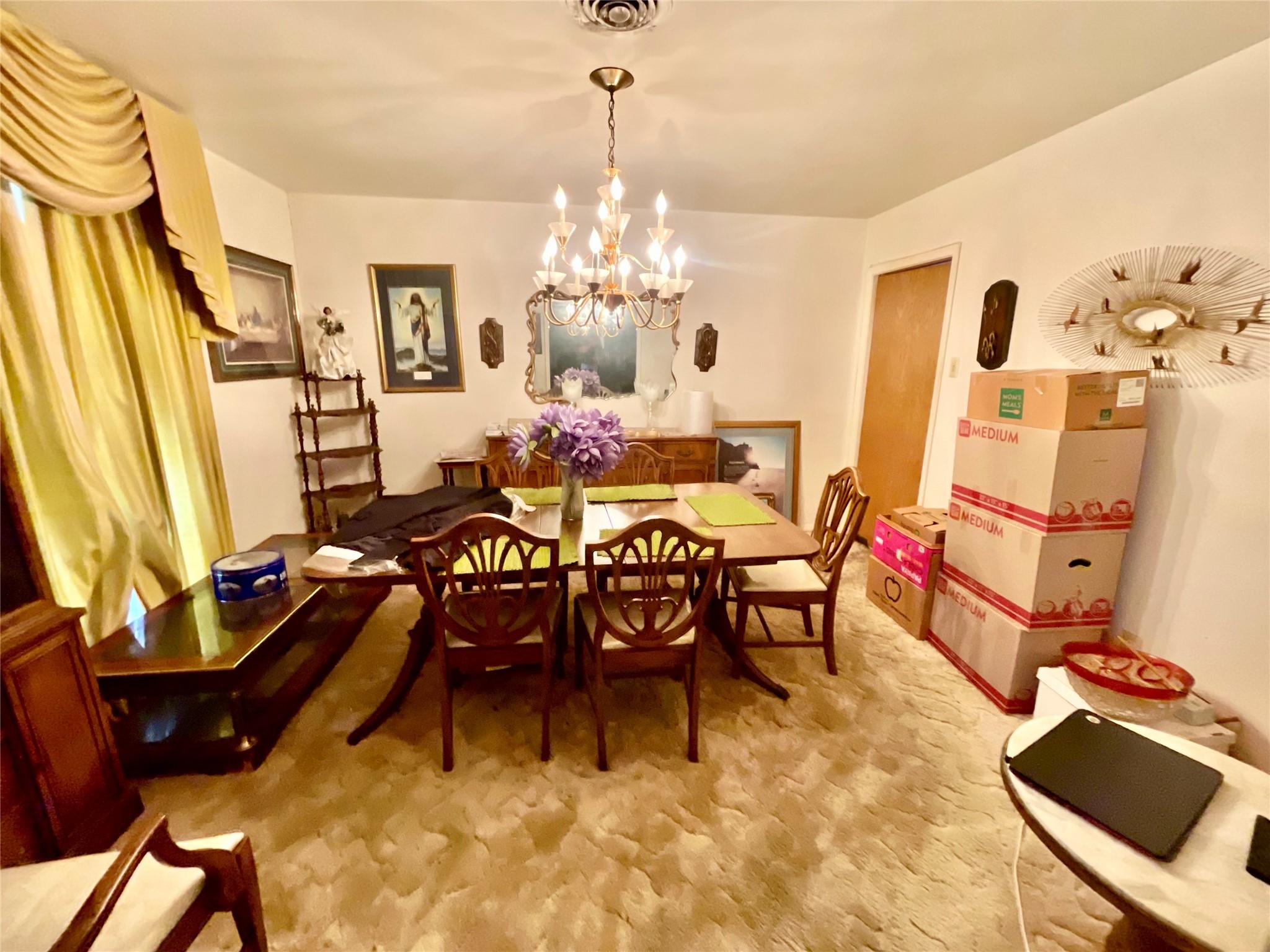 4314 Reed Road Houston, TX 77051 - Photo 7 of 21 a view of a dining room with furniture and a chandelier