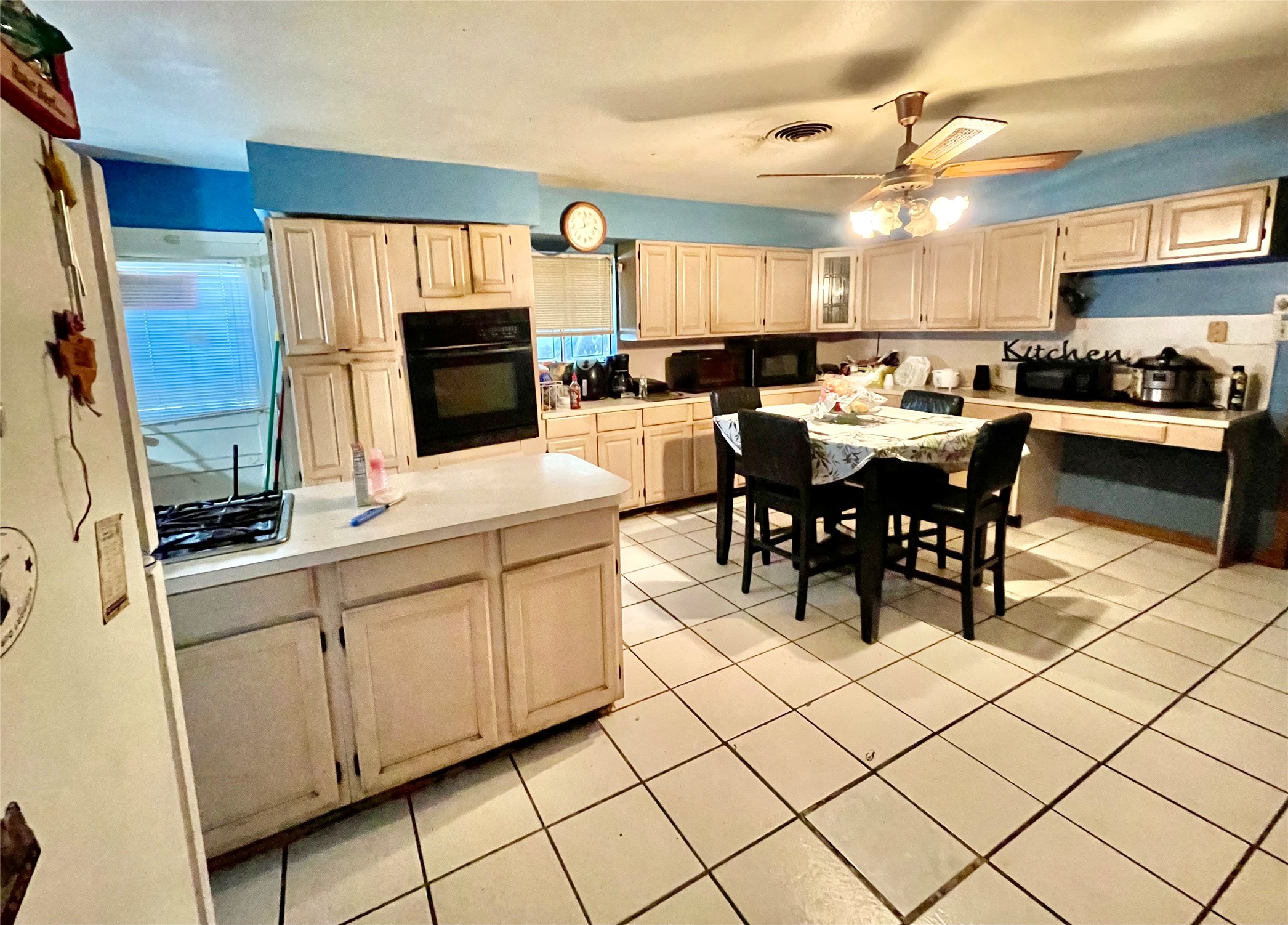 4314 Reed Road Houston, TX 77051 - Photo 8 of 21 a kitchen with stainless steel appliances kitchen island granite countertop a sink and cabinets