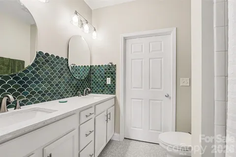 a bathroom with a sink and vanity