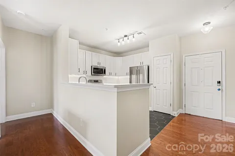 a view of a kitchen with electric appliances