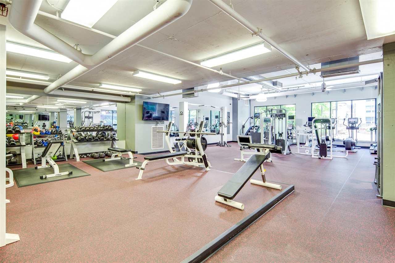 700 Grove Street, Unit 4V Jersey City, NJ 07310 - Photo 19 of 25 a view of a gym with lots of gym equipment