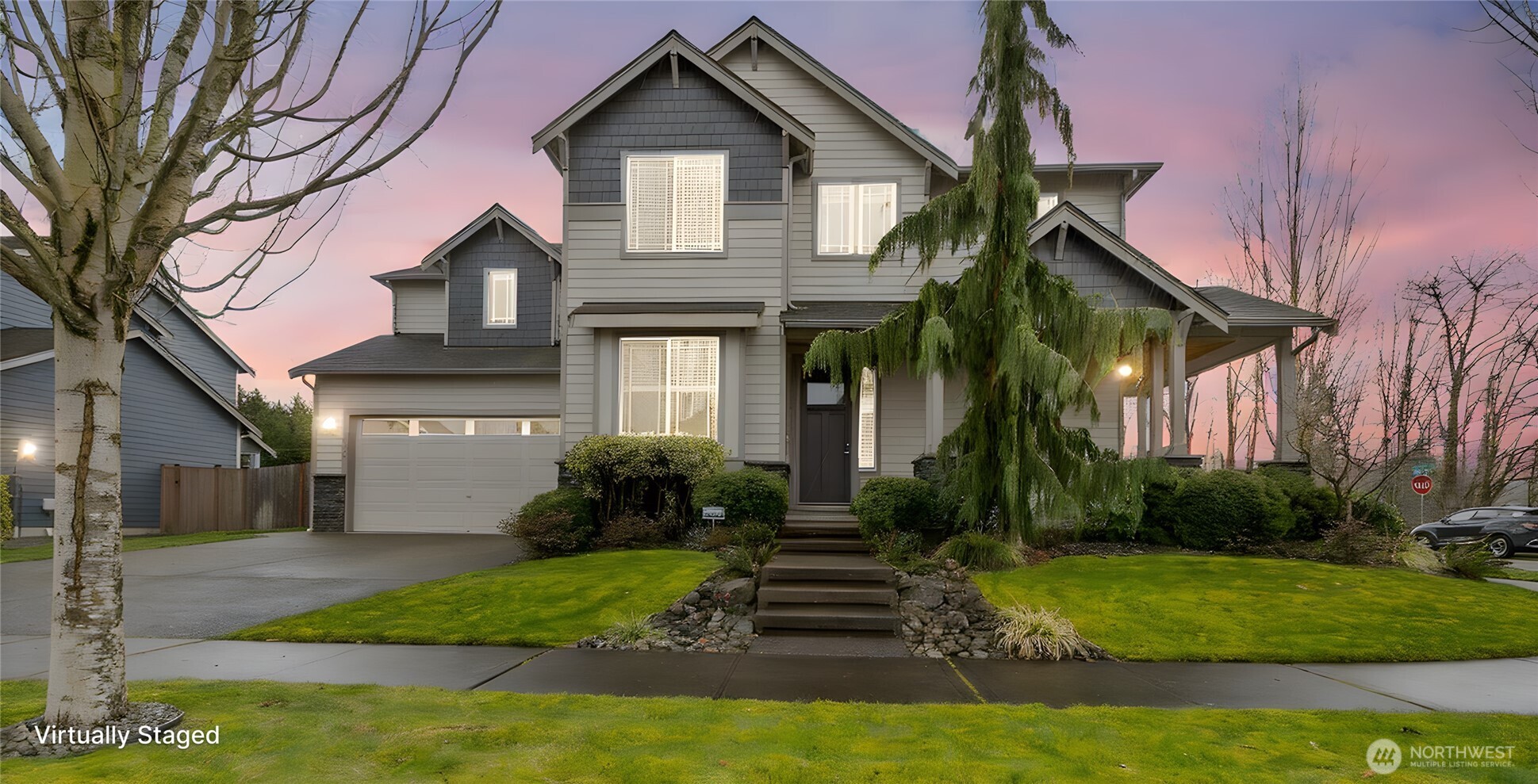 14925 Benton Loop Sumner, WA 98390 - Photo 1 of 40 a front view of a house with a yard and trees