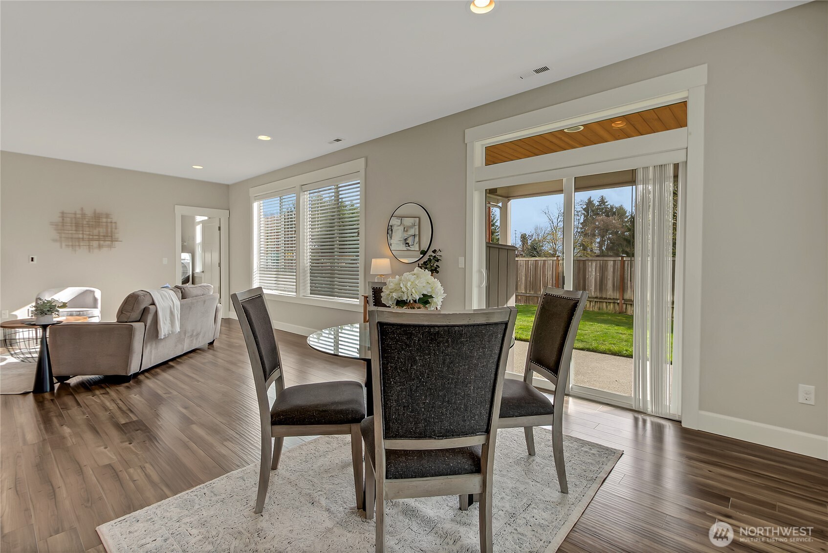 14925 Benton Loop Sumner, WA 98390 - Photo 12 of 40 a view of a dining room with furniture window and wooden floor