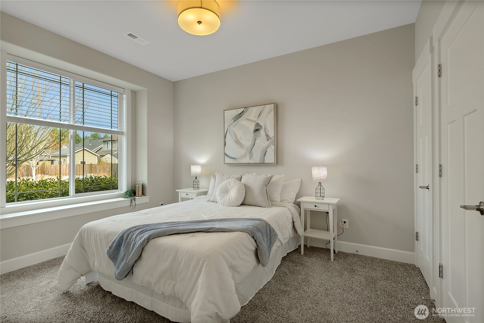 14925 Benton Loop Sumner, WA 98390 - Photo 18 of 40 a bedroom with a bed and a large window
