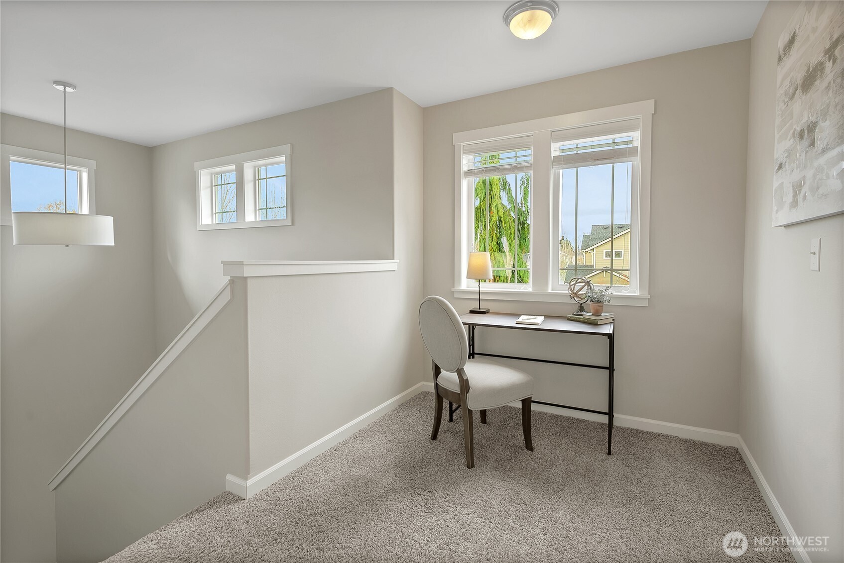 14925 Benton Loop Sumner, WA 98390 - Photo 21 of 40 a view of a workspace with furniture and a window