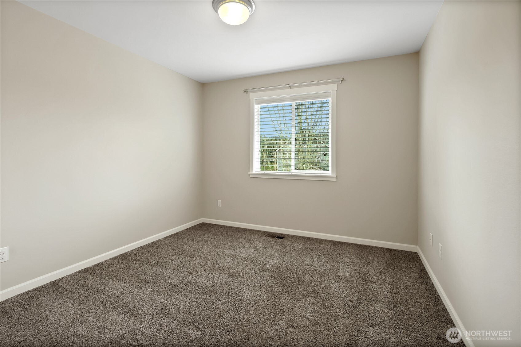 14925 Benton Loop Sumner, WA 98390 - Photo 23 of 40 an empty room with a window