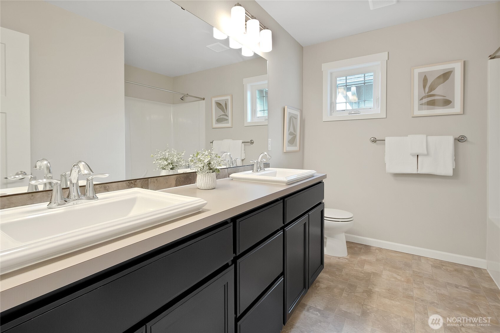 14925 Benton Loop Sumner, WA 98390 - Photo 24 of 40 a bathroom with a double vanity sink and a mirror