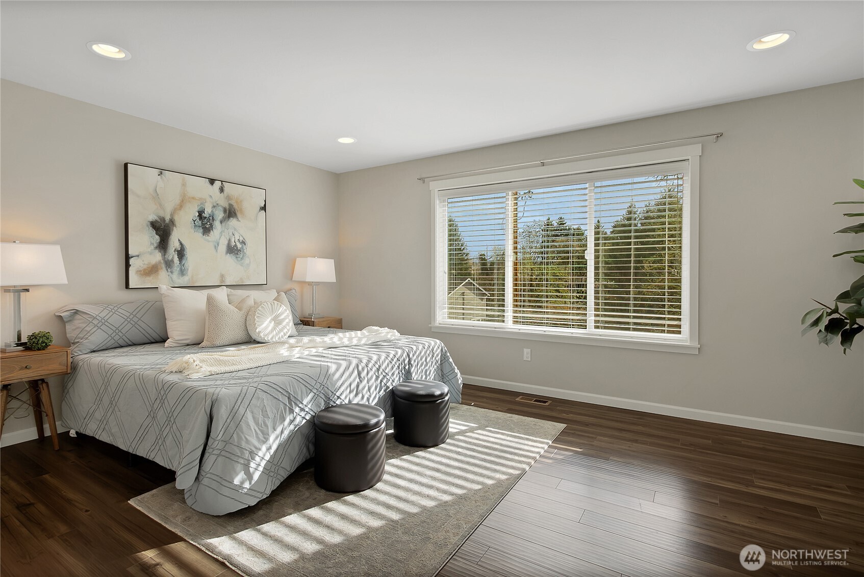 14925 Benton Loop Sumner, WA 98390 - Photo 25 of 40 a spacious bedroom with a large bed and a window