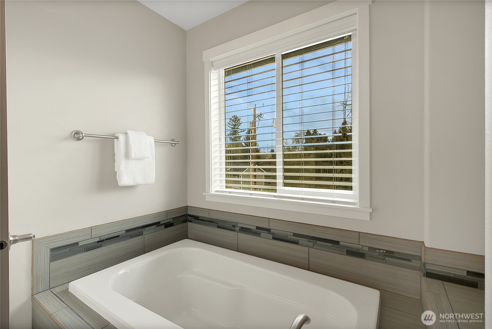 14925 Benton Loop Sumner, WA 98390 - Photo 29 of 40 a bath tub sitting in a bathroom next to a window