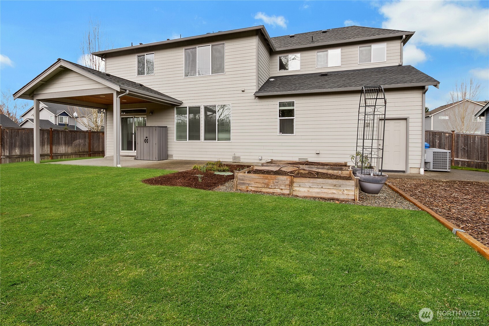 14925 Benton Loop Sumner, WA 98390 - Photo 33 of 40 a view of a house with a yard and sitting area