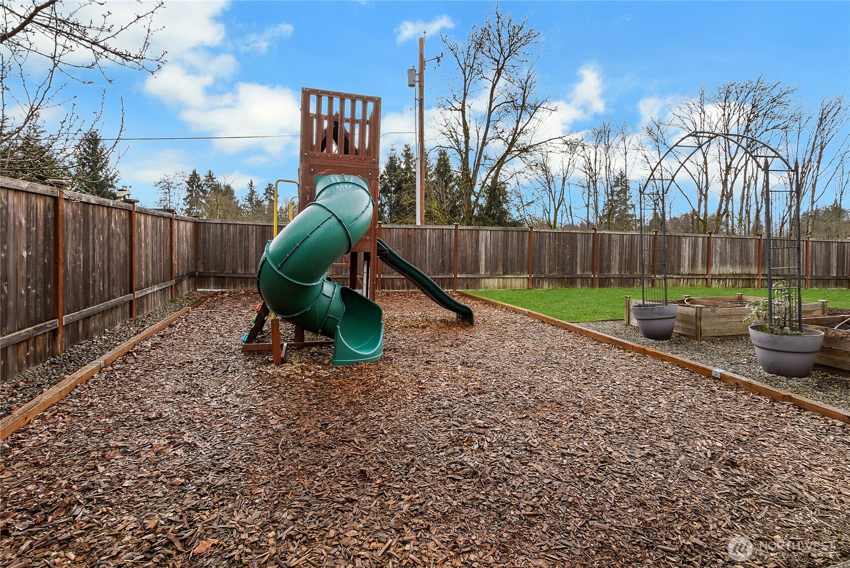 14925 Benton Loop Sumner, WA 98390 - Photo 34 of 40 a childrens park with lots of swings and slides